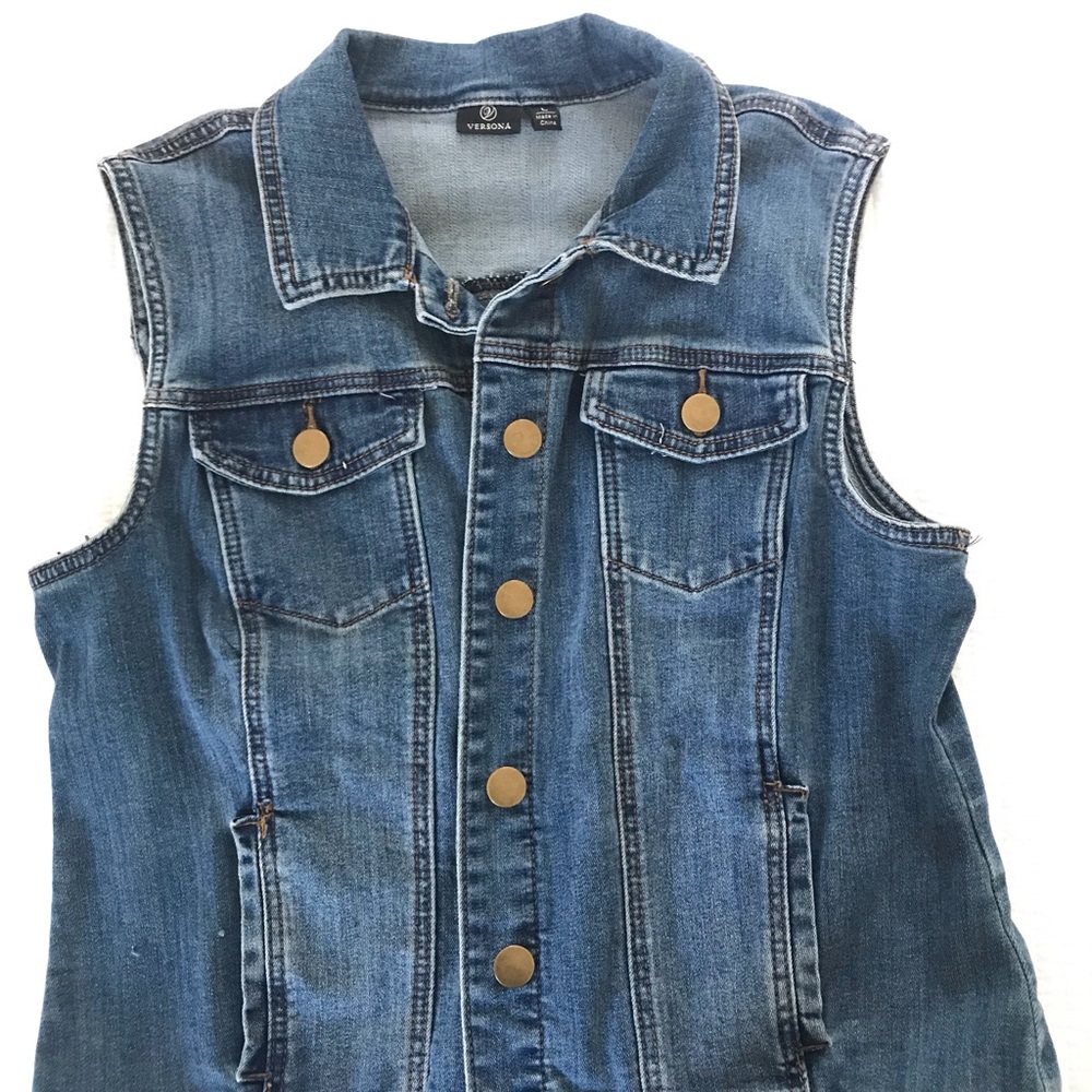Women’s denim trucker vest in dark blue wash.